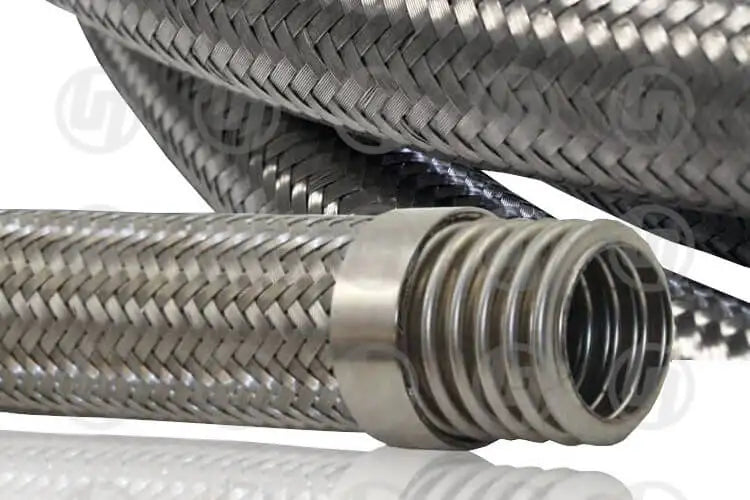 A section of stainless steel hose, the end showing a thread for connection